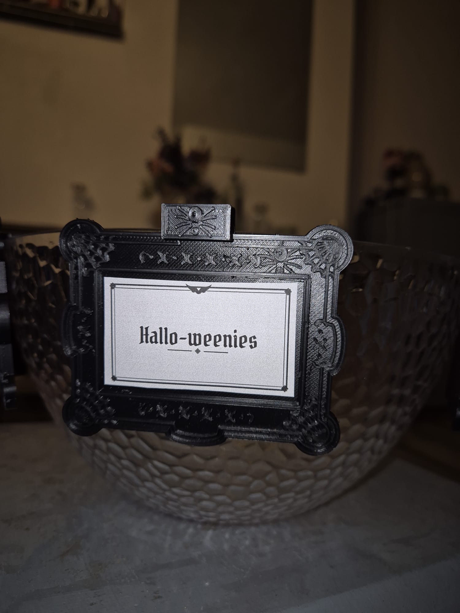 Tag reading "Hallo-weenies" on a glass bowl